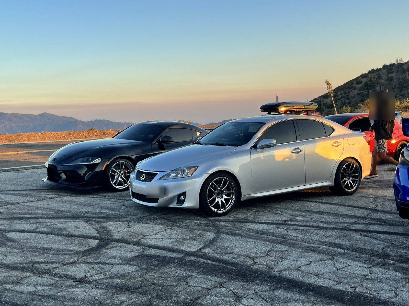Inari, a 2013 Lexus IS250, parked up in the mountains at sunset