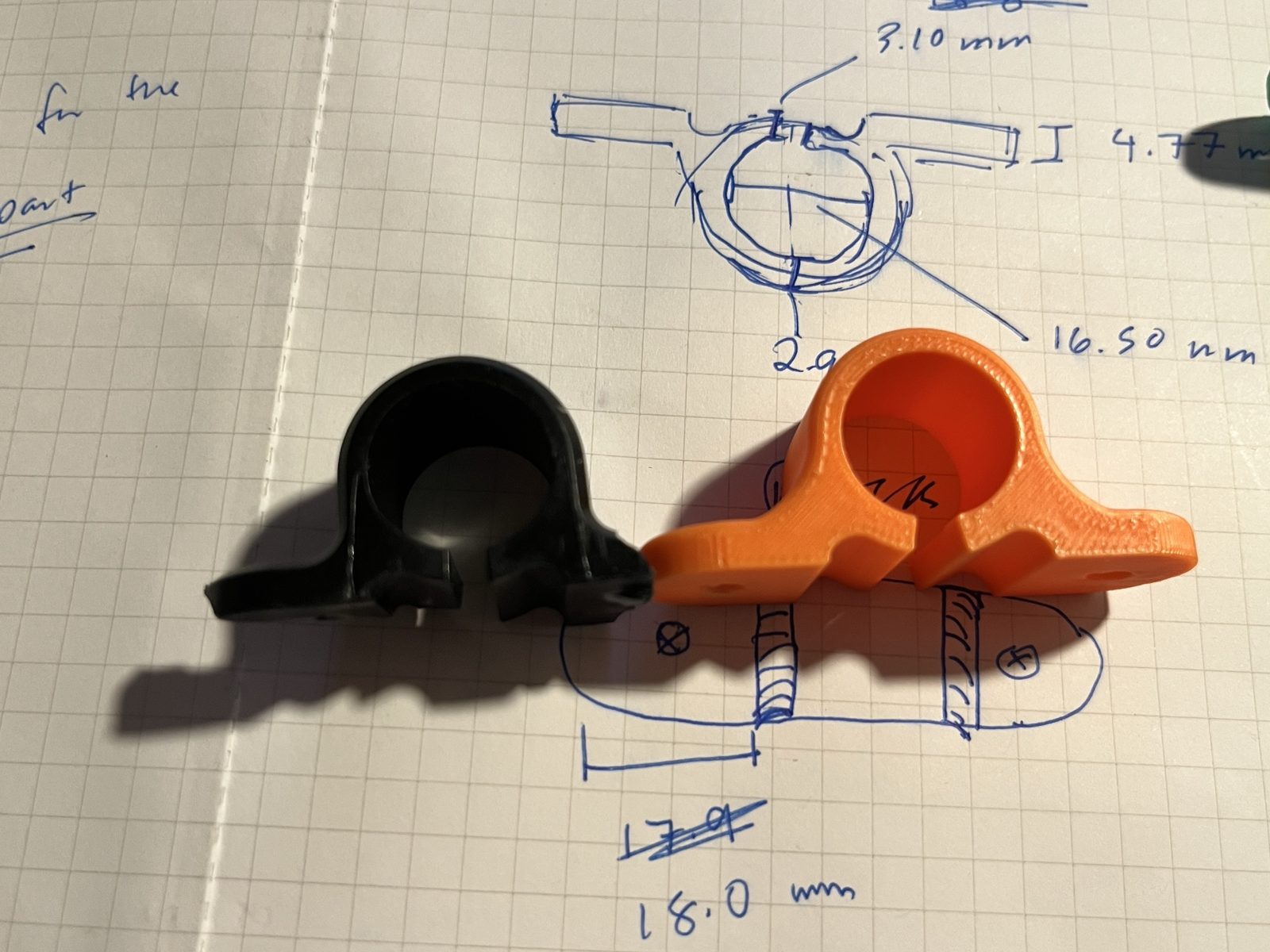 Printed brackets beside the broken original